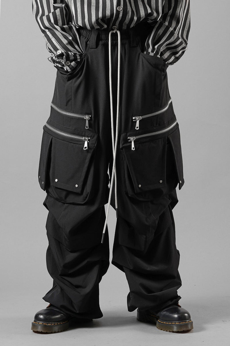 A.F ARTEFACT MULTI FLAP WIDE PANTS / TECH SMOOTH (BLACK) | エー
