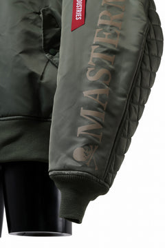 Load image into Gallery viewer, mastermind WORLD x ALPHA INDUSTRIES RIVERSIBLE MA-1 JACKET (OLIVE)