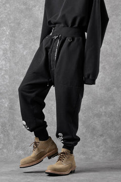 Load image into Gallery viewer, MASTERMIND WORLD x KATHARINE HAMNETT JOGGER PANTS (BLACK)