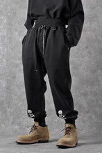 Load image into Gallery viewer, MASTERMIND WORLD x KATHARINE HAMNETT JOGGER PANTS (BLACK)