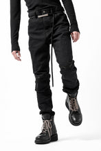 Load image into Gallery viewer, ISAMU KATAYAMA BACKLASH BLACK LEATHER KNEE PADS SLIM PANTS / "京都紋付 - 漆黒染" 13oz STRETCH DENIM (BLACK)