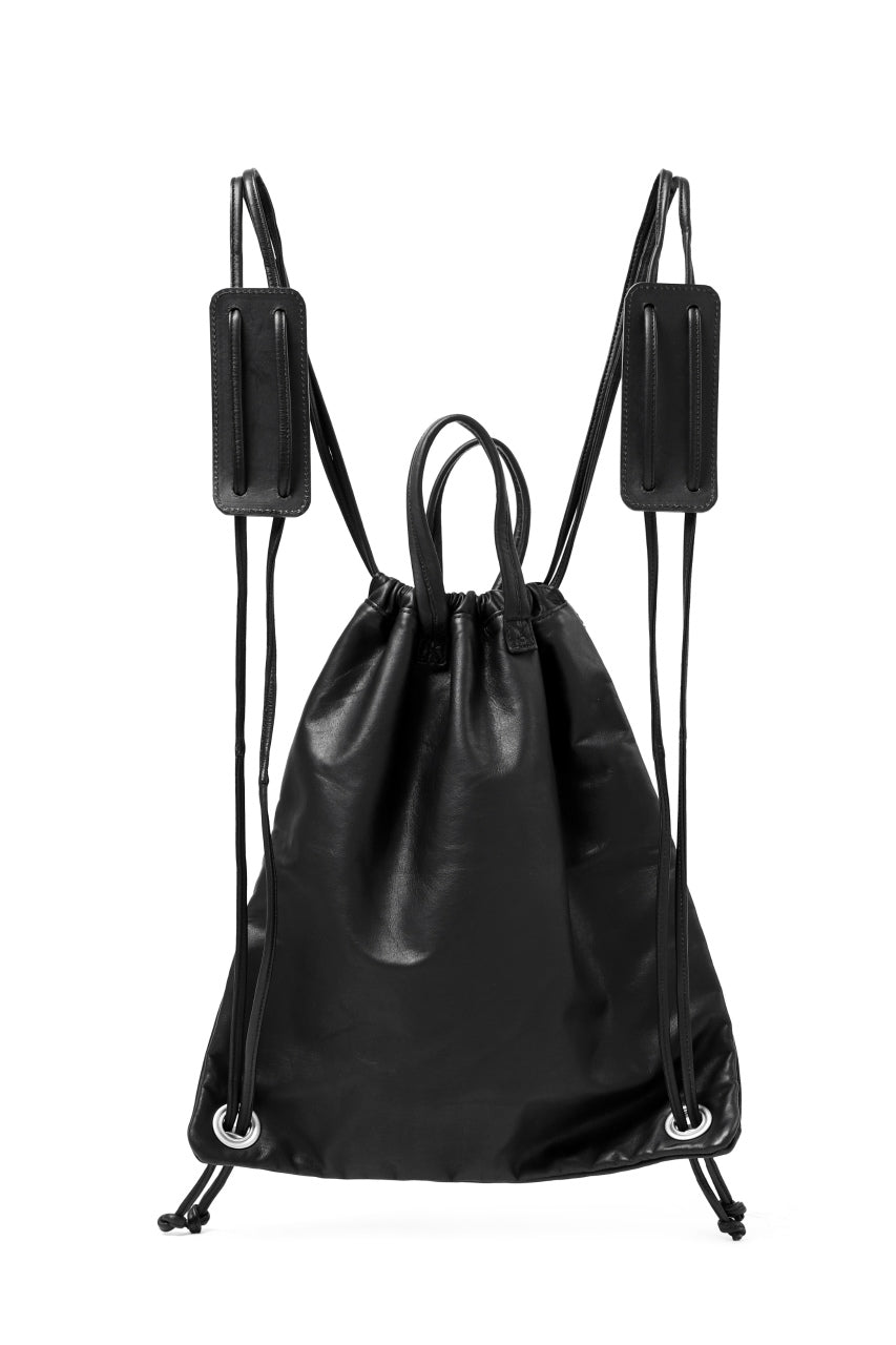 Load image into Gallery viewer, ISAMU KATAYAMA BACKLASH DRAWSTRING BACKPACK / MONOCHROME LUXURY STEER (BLACK)