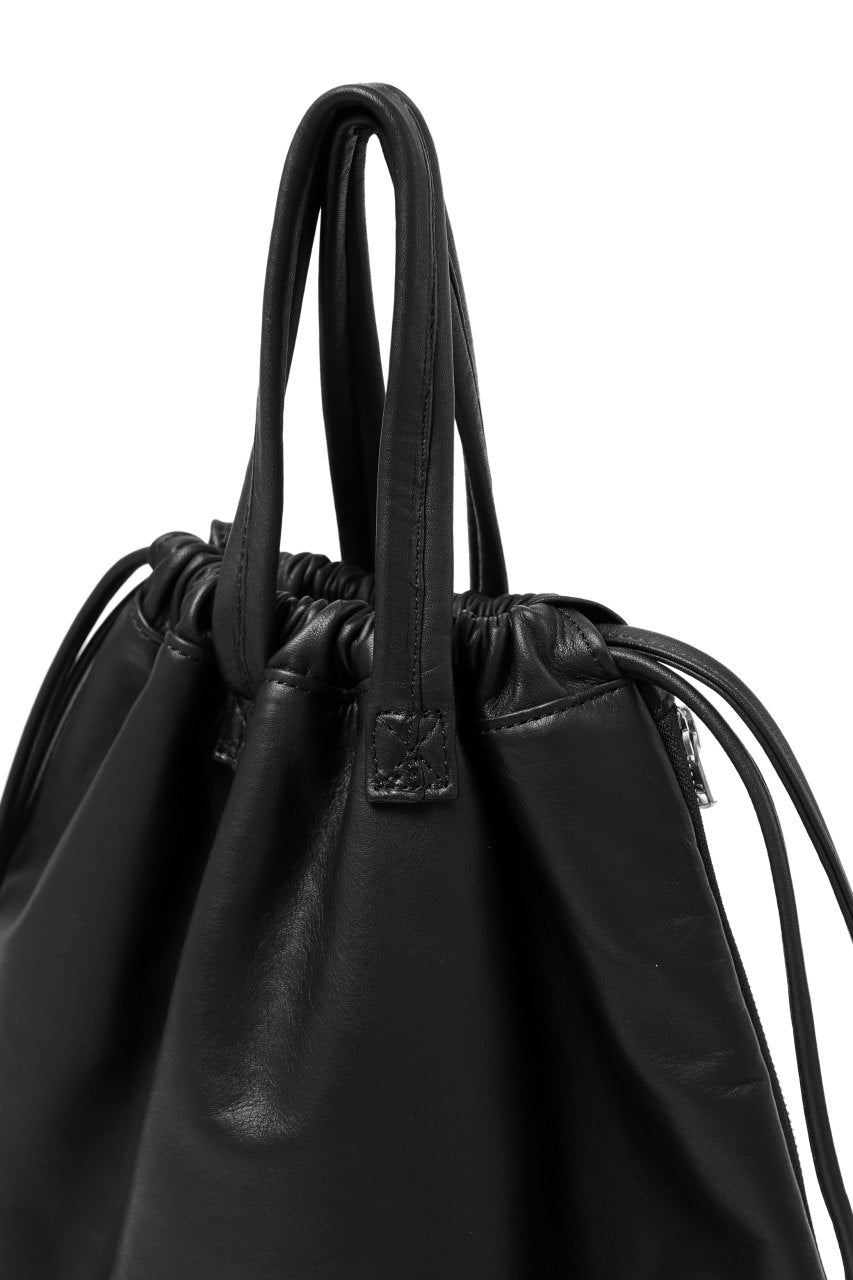 Load image into Gallery viewer, ISAMU KATAYAMA BACKLASH DRAWSTRING BACKPACK / MONOCHROME LUXURY STEER (BLACK)