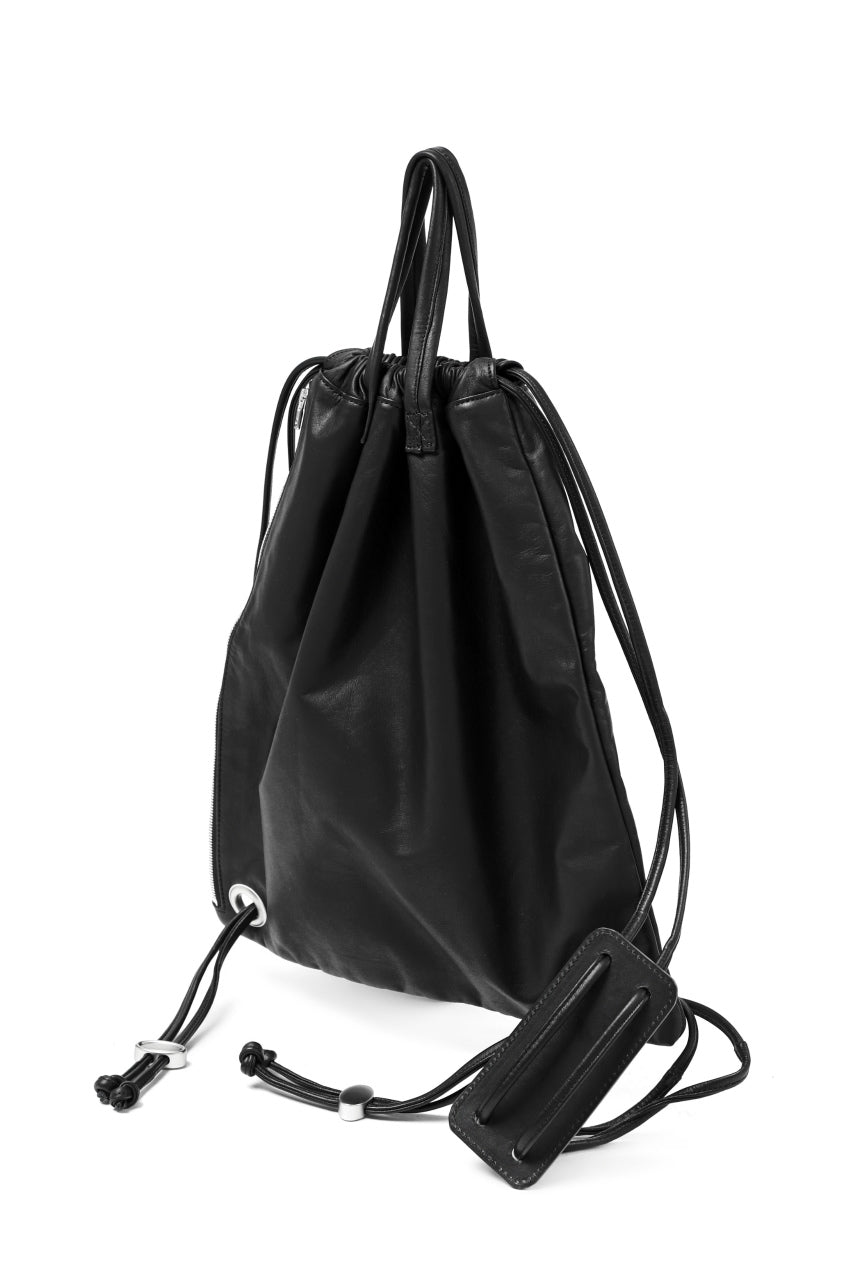 Load image into Gallery viewer, ISAMU KATAYAMA BACKLASH DRAWSTRING BACKPACK / MONOCHROME LUXURY STEER (BLACK)
