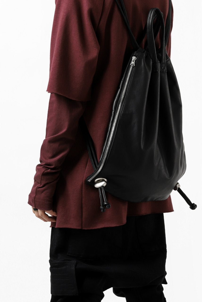 Load image into Gallery viewer, ISAMU KATAYAMA BACKLASH DRAWSTRING BACKPACK / MONOCHROME LUXURY STEER (BLACK)