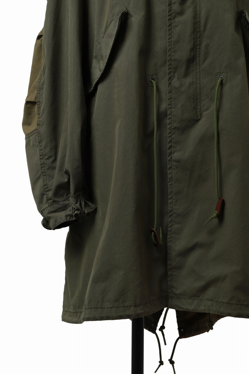 Load image into Gallery viewer, mastermind WORLD x ALPHA INDUSTRIES M-65 MODS COAT - CRAZY PANELED (OLIVE)
