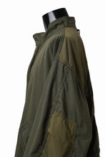 Load image into Gallery viewer, mastermind WORLD x ALPHA INDUSTRIES M-65 MODS COAT - CRAZY PANELED (OLIVE)