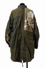 Load image into Gallery viewer, mastermind WORLD x ALPHA INDUSTRIES M-65 MODS COAT - CRAZY PANELED (OLIVE)
