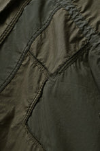 Load image into Gallery viewer, mastermind WORLD x ALPHA INDUSTRIES M-65 MODS COAT - CRAZY PANELED (OLIVE)