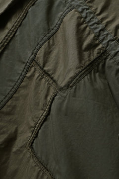 Load image into Gallery viewer, mastermind WORLD x ALPHA INDUSTRIES M-65 MODS COAT - CRAZY PANELED (OLIVE)