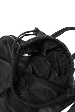 Load image into Gallery viewer, ISAMU KATAYAMA BACKLASH DRAWSTRING BACKPACK / MONOCHROME LUXURY STEER (BLACK)