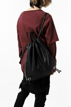 Load image into Gallery viewer, ISAMU KATAYAMA BACKLASH DRAWSTRING BACKPACK / MONOCHROME LUXURY STEER (BLACK)