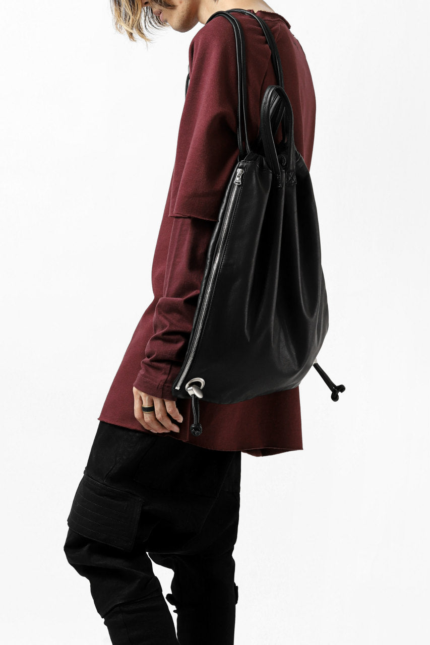 Load image into Gallery viewer, ISAMU KATAYAMA BACKLASH DRAWSTRING BACKPACK / MONOCHROME LUXURY STEER (BLACK)