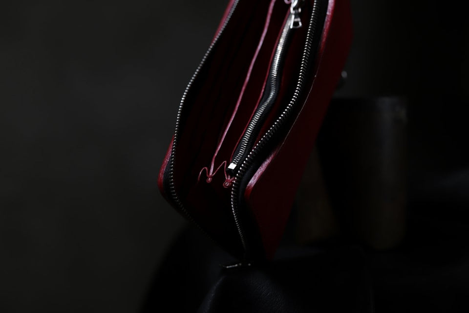 Load image into Gallery viewer, ISAMU KATAYAMA BACKLASH exclusive ROUND FASTNER WALLET / DOUBLE-SHOULDER OBJECT DYED (RED)