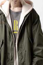 Load image into Gallery viewer, mastermind WORLD x ALPHA INDUSTRIES M-65 MODS COAT - CRAZY PANELED (OLIVE)
