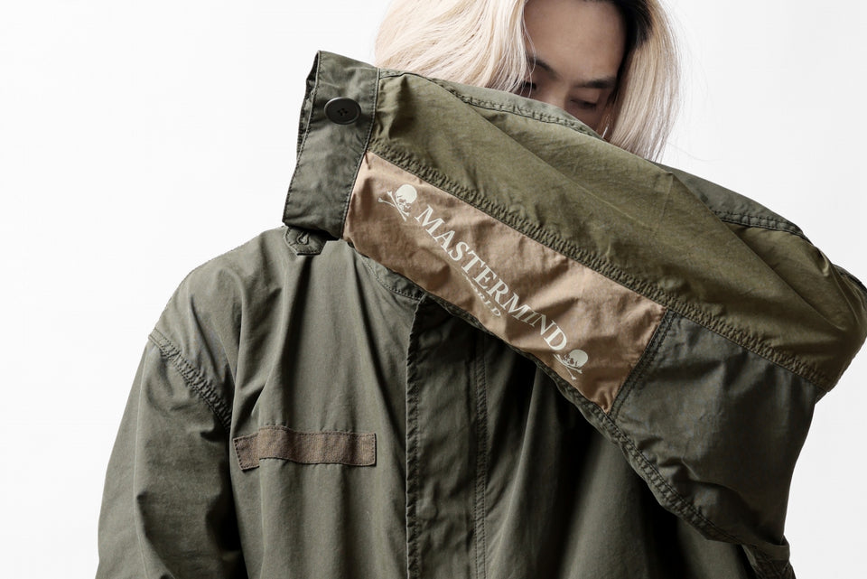 Load image into Gallery viewer, mastermind WORLD x ALPHA INDUSTRIES M-65 MODS COAT - CRAZY PANELED (OLIVE)