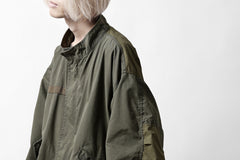 Load image into Gallery viewer, mastermind WORLD x ALPHA INDUSTRIES M-65 MODS COAT - CRAZY PANELED (OLIVE)