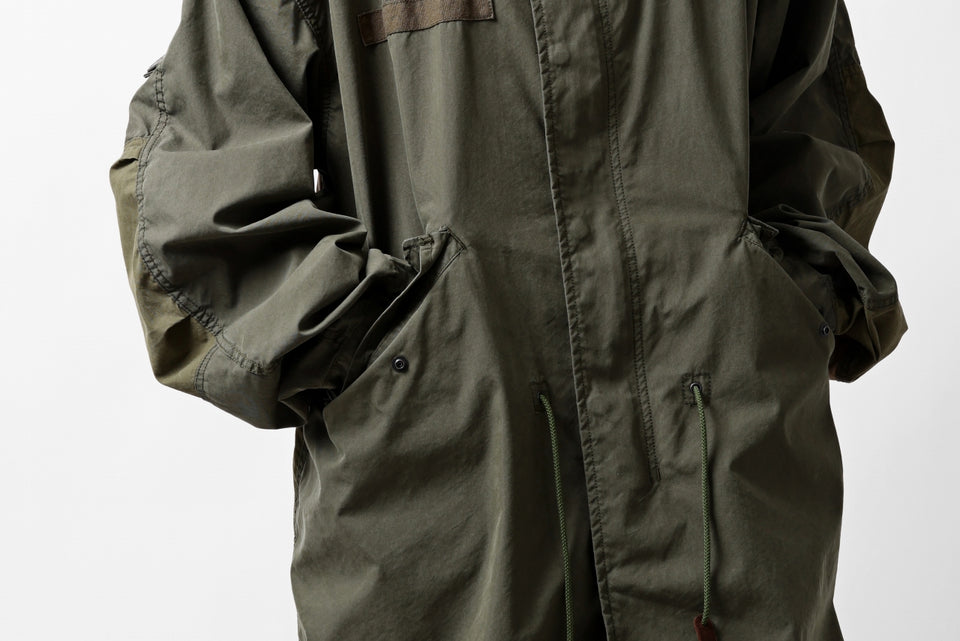 Load image into Gallery viewer, mastermind WORLD x ALPHA INDUSTRIES M-65 MODS COAT - CRAZY PANELED (OLIVE)