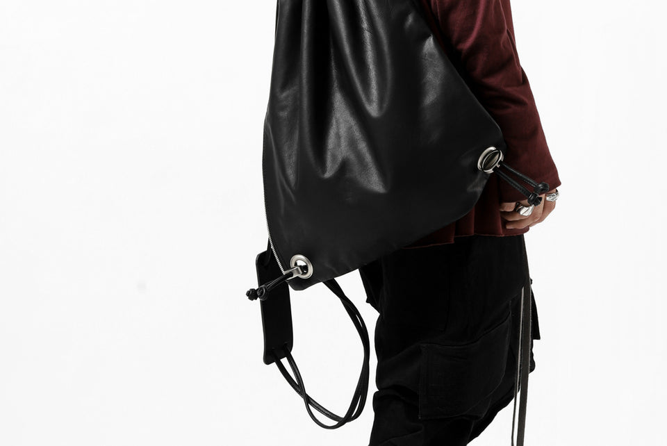 Load image into Gallery viewer, ISAMU KATAYAMA BACKLASH DRAWSTRING BACKPACK / MONOCHROME LUXURY STEER (BLACK)