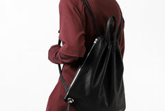 Load image into Gallery viewer, ISAMU KATAYAMA BACKLASH DRAWSTRING BACKPACK / MONOCHROME LUXURY STEER (BLACK)