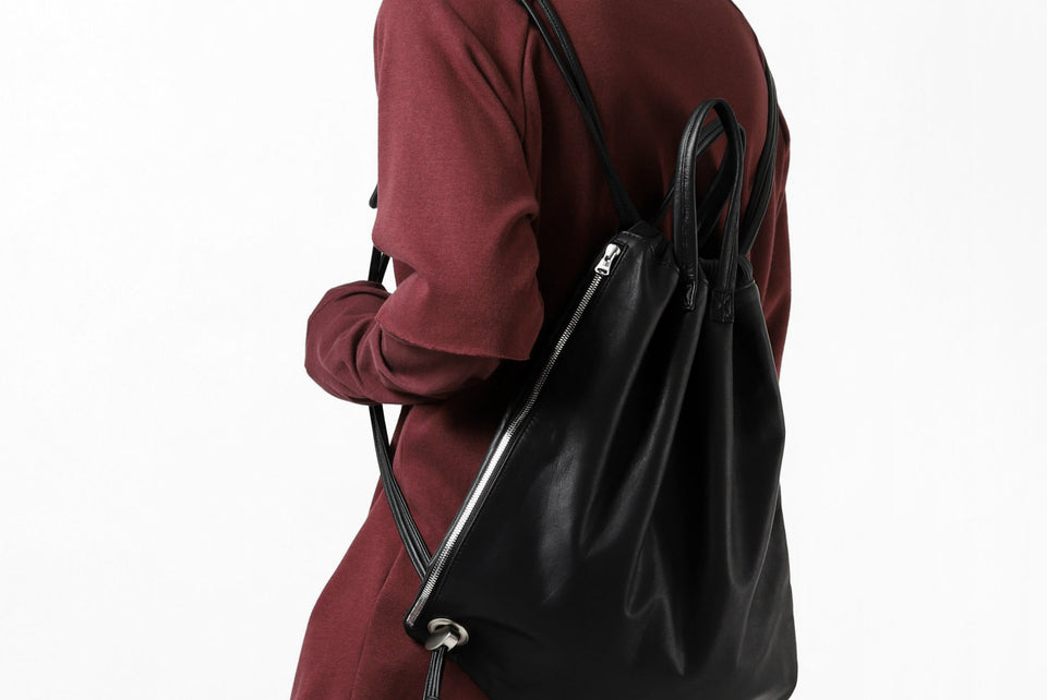 Load image into Gallery viewer, ISAMU KATAYAMA BACKLASH DRAWSTRING BACKPACK / MONOCHROME LUXURY STEER (BLACK)