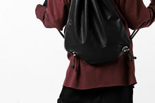 Load image into Gallery viewer, ISAMU KATAYAMA BACKLASH DRAWSTRING BACKPACK / MONOCHROME LUXURY STEER (BLACK)