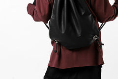 Load image into Gallery viewer, ISAMU KATAYAMA BACKLASH DRAWSTRING BACKPACK / MONOCHROME LUXURY STEER (BLACK)