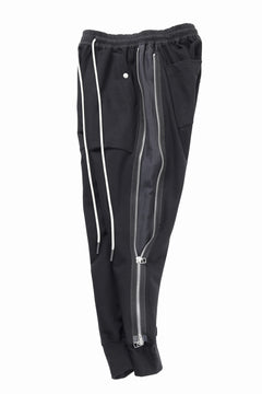 Load image into Gallery viewer, A.F ARTEFACT SIDE ZIP SARROUEL TRACK PANTS (BLACK)