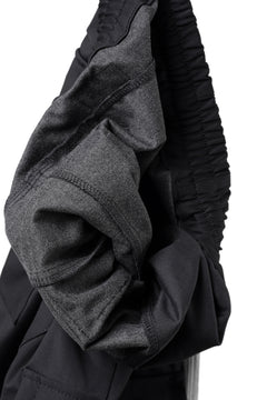 Load image into Gallery viewer, A.F ARTEFACT SARROUEL FLARE PANTS / TECH SMOOTH BONDING LW FLEECE (BLACK)