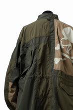 Load image into Gallery viewer, mastermind WORLD x ALPHA INDUSTRIES M-65 MODS COAT - CRAZY PANELED (OLIVE)