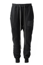 Load image into Gallery viewer, A.F ARTEFACT &quot;FRAYED&quot; DAMAGE SWEATER JOGGER PANTS (BLACK)