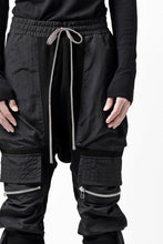 画像をギャラリービューアに読み込む, A.F ARTEFACT COMBINATION ZIPPER SARROUEL SKINNY PANTS / BOMBER HEAT® + NYLON (BLACK)